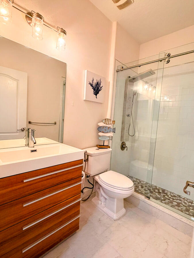 Bathroom 2 - upgraded with frameless shower and multi jet shower unit Bathroom 2 - upgraded with frameless shower and multi jet shower unit