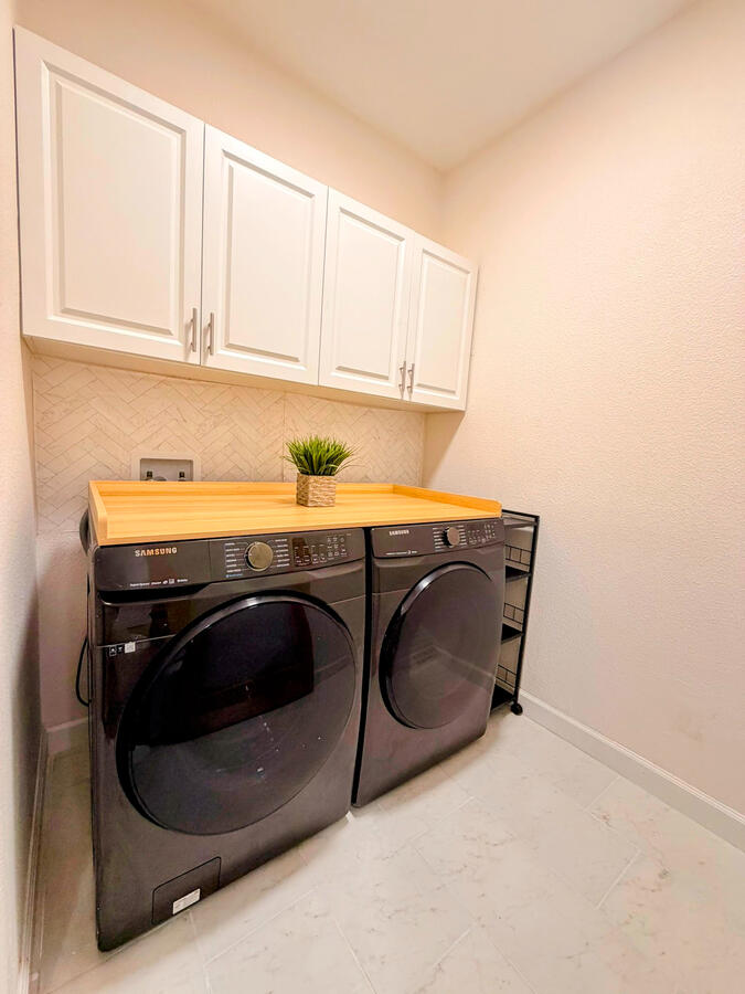 Laundry with cabinets Laundry with cabinets