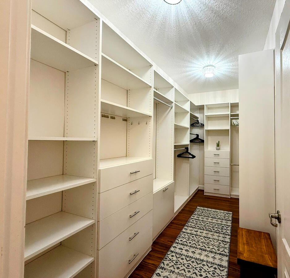 Fully upgraded walk in closet with modern light fixtures Fully upgraded walk in closet with modern light fixtures